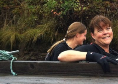 Two River Spirit paddlers smiling in the dragon boat