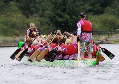 River Spirit crew paddling hard in a dragon boat race